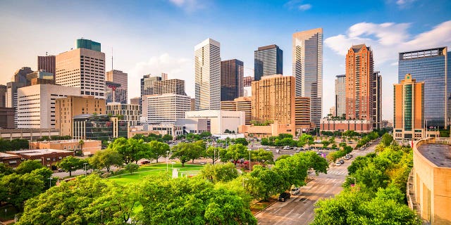 Houston, Texas, USA downtown city skyline over Root Square.