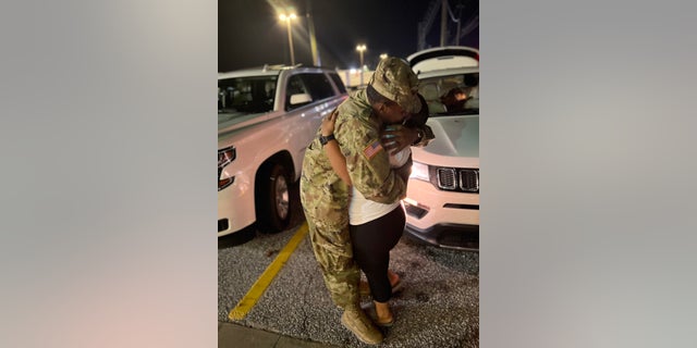 Destiny and Aaron Stovall share a moment of pure bliss when they are reunited outside Fort Benning after months apart. 