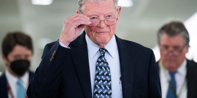 Sen. Jim Inhofe arrives for a Senate Armed Services Committee hearing on Sept. 28, 2021.