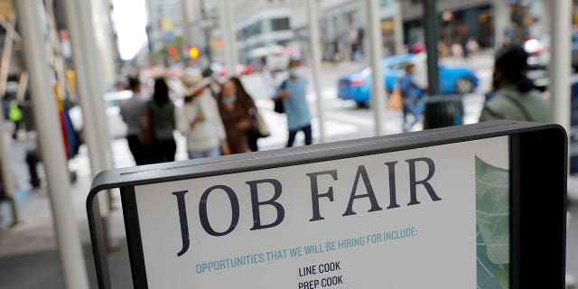 Signage for a job fair is seen on Fifth Avenue after the release of the jobs report in Manhattan, New York City, on Sept. 3, 2021.