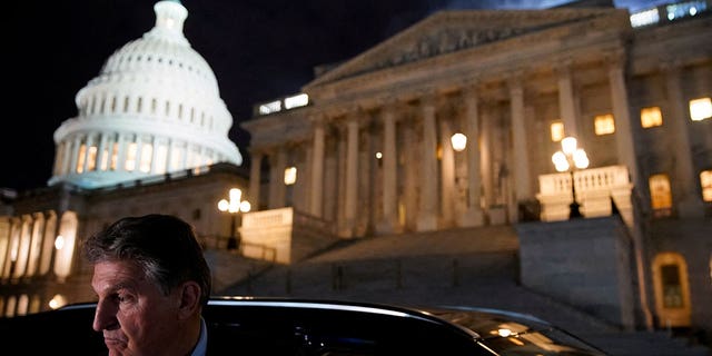 U.S. Senator Joe Manchin (D-WV) gets into a car as he leaves the U.S. Capitol in Washington, U.S., December 15, 2021. REUTERS/Elizabeth Frantz