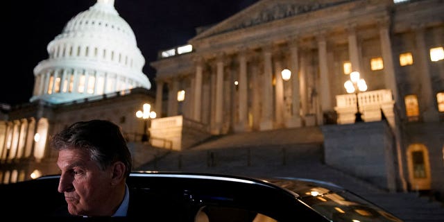 Sen. Joe Manchin gets into a car as he leaves the U.S. Capitol on Dec. 15, 2021.