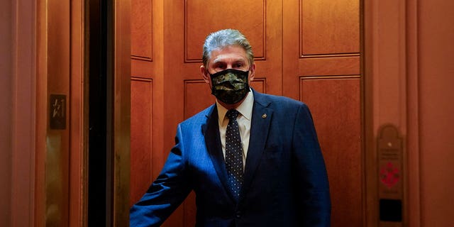 U.S. Senator Joe Manchin (D-WV) closes the door of an elevator after a Democratic policy luncheon at the U.S. Capitol in Washington, U.S., December 16, 2021.