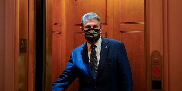 Sen. Joe Manchin closes the door of an elevator after a Democratic policy luncheon at the U.S. Capitol in Washington on Dec. 16, 2021.