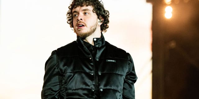 Jack Harlow demanded a Cobb County police officer be fired after video footage circulated of an officer putting his hands around a woman's neck outside the singer's concert.