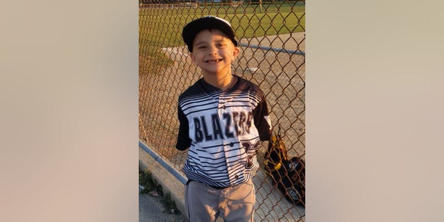 Photo included in Jackson Sparks' obituary shows the 8 year old wearing a Waukesha Sparks baseball jersey.