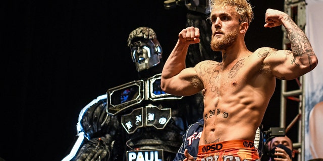 YouTube personality Jake Paul gestures Dec. 17, 2021, during his weigh-in ahead of his fight against martial artist Tyron Woodley in Tampa, Fla.