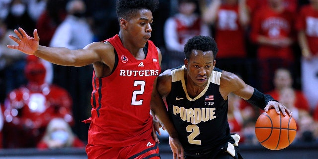 Purdue guard Eric Hunter Jr. (2) drives to the basket against Rutgers guard Jalen Miller (2) during the first half of an NCAA college basketball game in Piscataway, N.J., Thursday, Dec. 9, 2021.