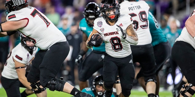 Northern Illinois running back Jay Ducker (8) runs the ball against Coastal Carolina during the Cure Bowl in Orlando, Fla., Friday, Dec. 17, 2021.