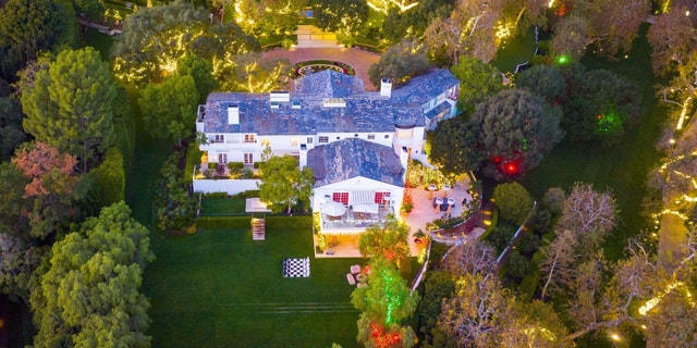 Jeff Bezos' home near Sunset Boulevard decorated in red and green lights to celebrate the holidays.