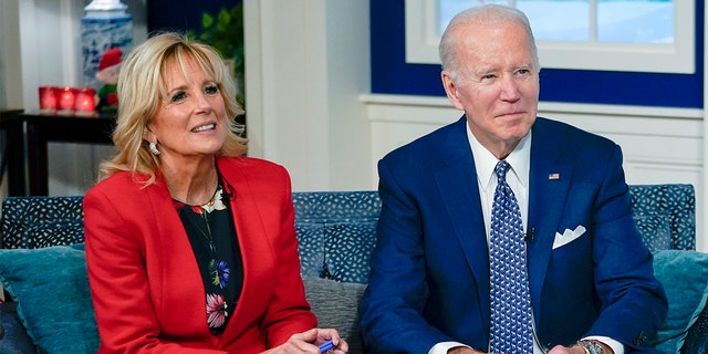 President Biden and first lady Jill Biden speak with the NORAD Tracks Santa Operations Center on Peterson Air Force Base, Colo., via teleconference in the South Court Auditorium on the White House campus in Washington Dec. 24, 2021.
