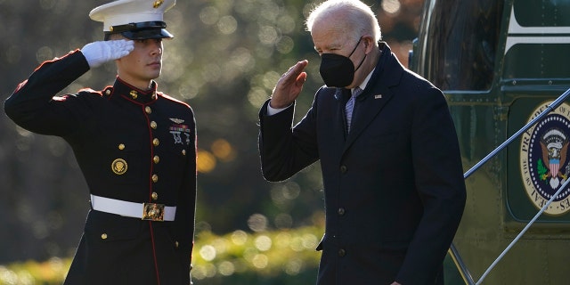 President Biden salutes as he steps off Marine One on the South Lawn of the White House in Washington, Monday, Dec. 20, 2021.
