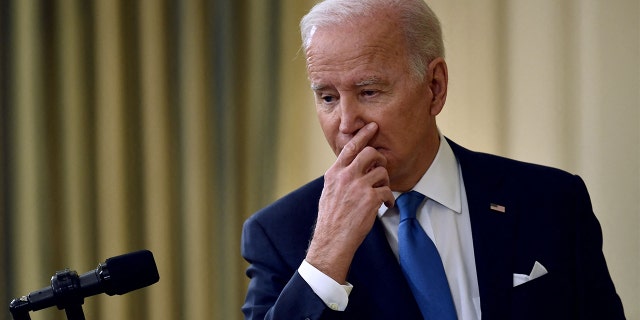 President Biden answers questions after speaking about the status of the country's fight against COVID-19 and the Omicron variant, in the State Dining Room of the White House in Washington, on Dec. 21, 2021.