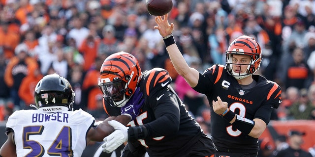 Joe Burrow #9 of the Cincinnati Bengals throws a pass during the first quarter in the game against the Baltimore Ravens at Paul Brown Stadium on December 26, 2021 in Cincinnati, Ohio.