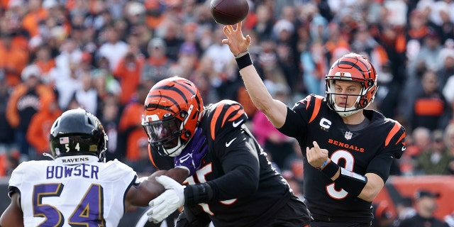 Joe Burrow #9 of the Cincinnati Bengals throws a pass during the first quarter in the game against the Baltimore Ravens at Paul Brown Stadium on December 26, 2021 in Cincinnati, Ohio.