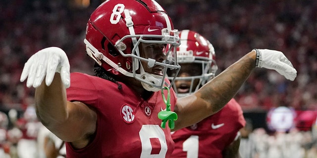 Alabama wide receiver John Metchie III celebrates his touchdown catch against Georgia during the Southeastern Conference championship on Saturday, Dec. 4, 2021, in Atlanta.