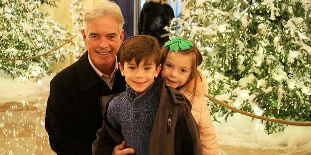 John Roberts with his young twins, Kellan and Sage, at the White House one Christmas in a photo that appears in ‘All American Christmas.’ "I've been fortunate," Roberts says — and shares a personal story of perseverance through hardship. 