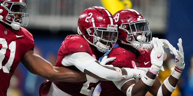 Alabama defensive back Jordan Battle (9) celebrates his interception and touchdown against Georgia during the second half of the Southeastern Conference championship Saturday, Des. 4, 2021, in Atlanta.