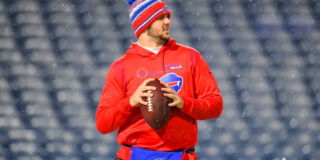 Dec 6, 2021; Orchard Park, New York, USA; Buffalo Bills quarterback Josh Allen (17) warms up prior to the game against the New England Patriots at Highmark Stadium.