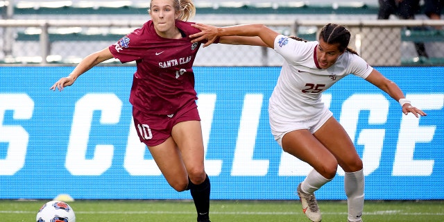 Kelsey Turnbow (10) of the Santa Clara Broncos battles Emily Madril (25) of the Florida State Seminoles for the ball during the Division I Women's Soccer Championship at Sahlens Stadium at Wakemed Soccer Park May 17, 2021 in Cary, North Carolina.