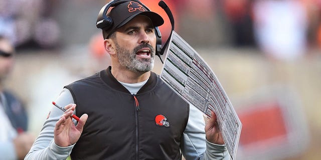 FILE - Cleveland Browns head coach Kevin Stefanski reacts during the second half of an NFL football game against the Baltimore Ravens, Sunday, Dec. 12, 2021, in Cleveland.  Quarterback Baker Mayfield and Stefanski tested positive for COVID-19 on Wednesday, Dec. 15,  and will likely miss Saturday’s game against the Las Vegas Raiders as Cleveland deals with a widespread outbreak during its playoff pursuit.