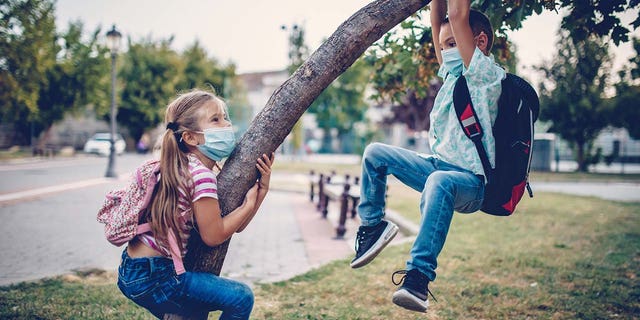 Kids are shown playing outside their school. Scores of families across the country are right now starting to get ready for the back-to-school season.