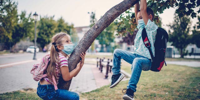 Kids are shown playing outside their school. Scores of families across the country are right now starting to get ready for the back-to-school season.