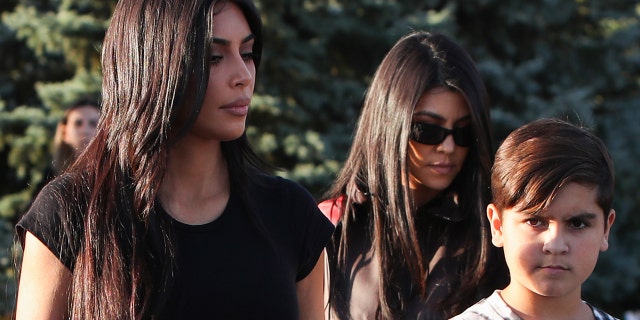 Kim Kardashian (left), sister of Mason Disicks (right) mother Kourtney (center), shared the conversation in celebration of Mason's birthday, calling him 'a helpful king'.