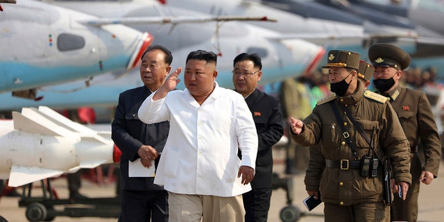 FILE: North Korean leader Kim Jong Un inspects an air defense unit in western area, North Korea. The North on Thursday, Dec. 30, 2021, urged its 1.2 million troops to unite behind leader Kim and defend him with their lives, as the country celebrated the 10th anniversary of his ascension to supreme commander of the military. 