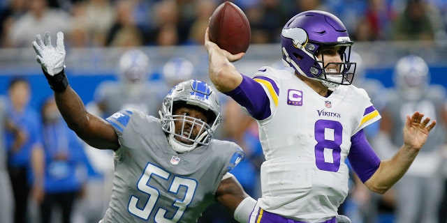 Detroit Lions outside linebacker Charles Harris (53) pressures Minnesota Vikings quarterback Kirk Cousins (8) during the first half Sunday, Dec. 5, 2021, in Detroit.