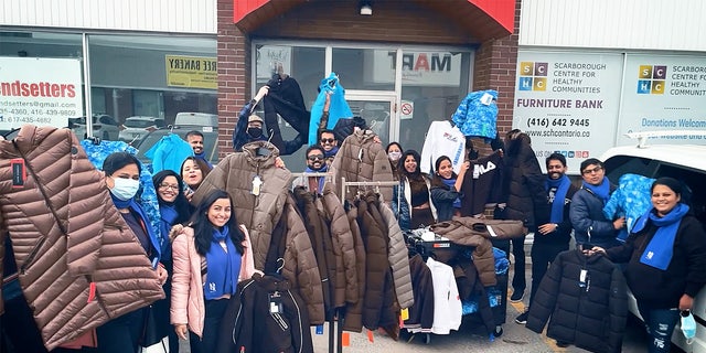 Klick Health employees pool money together to buy coats for those in need.