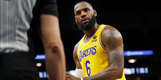 Los Angeles Lakers forward LeBron James questions a referee during a game against the Minnesota Timberwolves on Dec. 17, 2021, in Minneapolis.