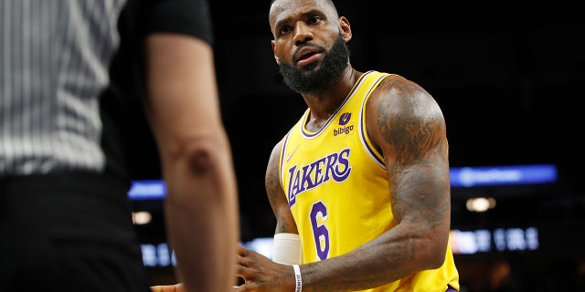 Los Angeles Lakers forward LeBron James questions a referee during a game against the Minnesota Timberwolves on Dec. 17, 2021, in Minneapolis.