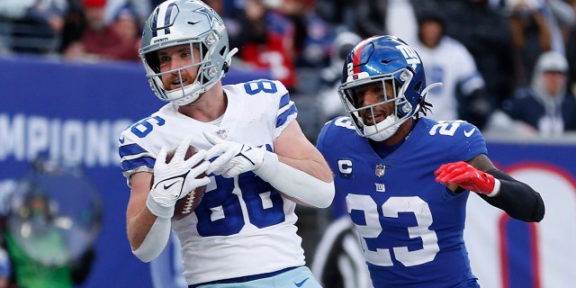 Dalton Schultz #86 of the Dallas Cowboys catches the ball for a touchdown in front of Logan Ryan #23 of the New York Giants during the third quarter at MetLife Stadium on Dec. 19, 2021 in East Rutherford, New Jersey.