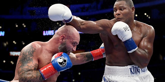 Luis Ortiz punches Travis Kauffman in a 10th-round Ortiz knoockout win during a heavyweight bout at Staples Center on Dec. 1, 2018, in Los Angeles, California.