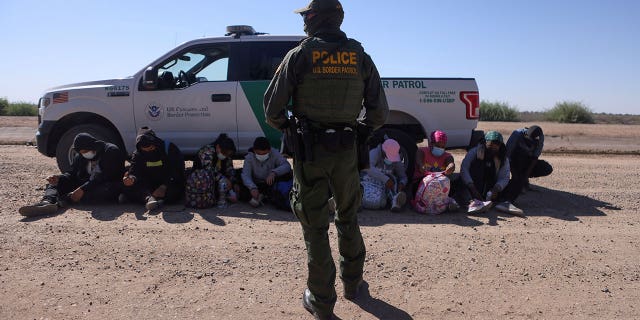 A group of asylum seekers from Mexico, Cuba and Haiti are detained by U.S. Border Patrol in San Luis, Arizona, April 19, 2021.