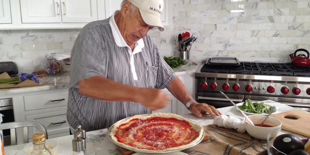 Maria Bartiromo's dad, Vincent, made "amazing pizza," she says in the new book ‘All American Christmas.’ This photo of him hard at work in the kitchen, plus many other photos, essays, recipes, and more, appear in the book by Rachel Campos-Duffy and Sean Duffy. 