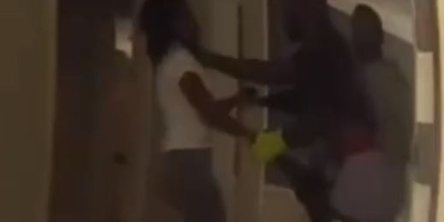 The Braves outfielder appeared to be choking his wife as an officer walked in.