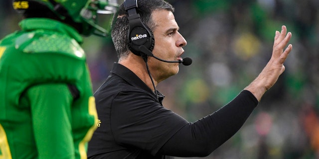 Oregon head coach Mario Cristobal directs his players during the fourth quarter of an NCAA college football game against Oregon State, Saturday, Nov. 27, 2021, in Eugene, Oregon.