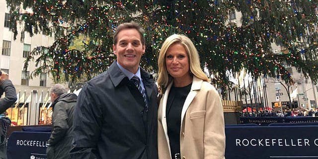 Bill Hemmer at Rockefeller Center in midtown Manhattan with Fox News colleague Martha MacCallum during the Christmas season. While his "professional home has been in New York City for the past twenty years," he says in the book, "Christmas wouldn't be Christmas without the satisfied feeling of being at home with family."