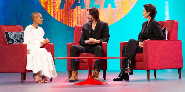 Keanu Reeves (center) revealed during an episode of Facebook Watch's "Red Table Talk" that he'd choose to live as Neo, his "Matrix" character, over living as John Wick in real life.