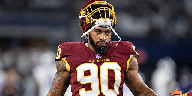 Montez Sweat # 90 from the Washington Football Team warms up before a game against the Dallas Cowboys at AT&T Stadium on December 26, 2021 in Arlington, Texas.  