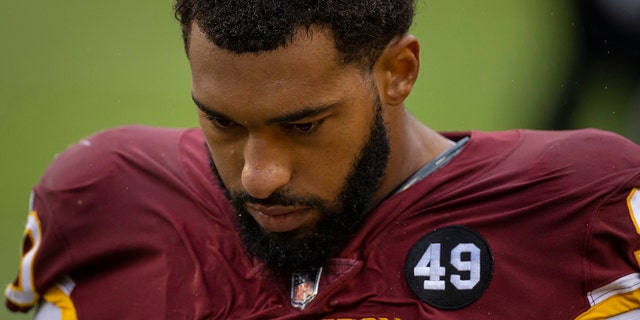 Montez Sweat walks off the field to receive attention during the second half of the game against the Dallas Cowboys at FedExField on Oct. 25, 2020 in Landover, Maryland.