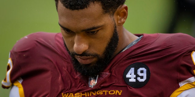Montez Sweat walks off the field to receive attention during the second half of the game against the Dallas Cowboys at FedExField on Oct. 25, 2020 in Landover, Maryland.