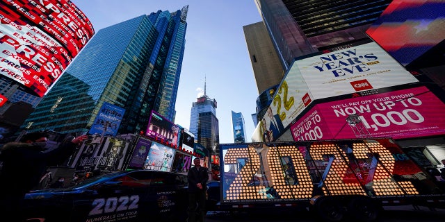 The 2022 sign that will be lit on top of a building on New Year's Eve is displayed in Times Square, New York on Monday.