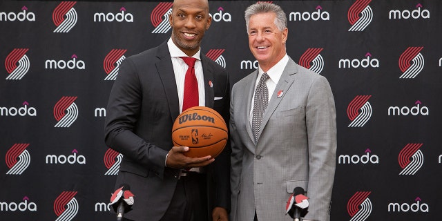 Chauncey Billups is introduced as the new head coach of the Portland Trail Blazers by Portland Trail Blazer General Manager Neil Olshey at the team's at the team's practice facility in Portland, Oregon.