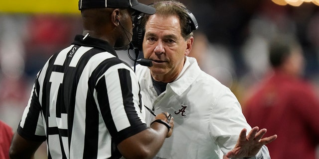 Alabama head coach Nick Saban speaks to an official during the first half of the Southeastern Conference championship NCAA college football game against Georgia, Saturday, Dec. 4, 2021, in Atlanta.