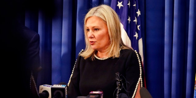 Oakland County prosecutor Karen McDonald addresses the media in her office, Friday, Dec. 3, 2021, in Pontiac, Mich. McDonald filed involuntary manslaughter charges against Jennifer and James Crumbley, the parents of 15-year-old Ethan Crumbley, who is accused of killing four students at a Michigan high school. McDonald says the gun used in the shootings at Oxford High School was purchased by James Crumbley a week ago and given to the boy.