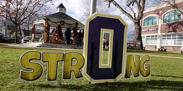 A sign in Centennial Park shows support for the students and staff killed and wounded in the November 30 shooting at Oxford High School on December 2, 2021 in Oxford, Michigan.