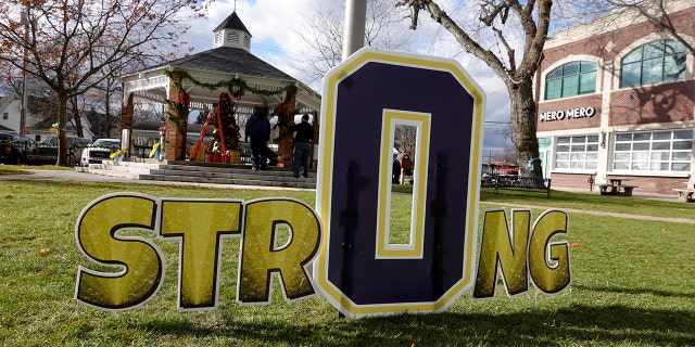 A sign in Centennial Park shows support for the students and staff killed and wounded in the November 30 shooting at Oxford High School on December 2, 2021 in Oxford, Michigan. 